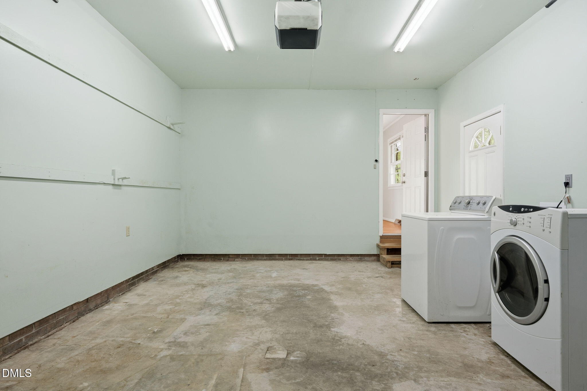 511 Hunter Street Durham, NC 27712 - Photo 23 of 30 a view of a storage & utility room with washer and dryer