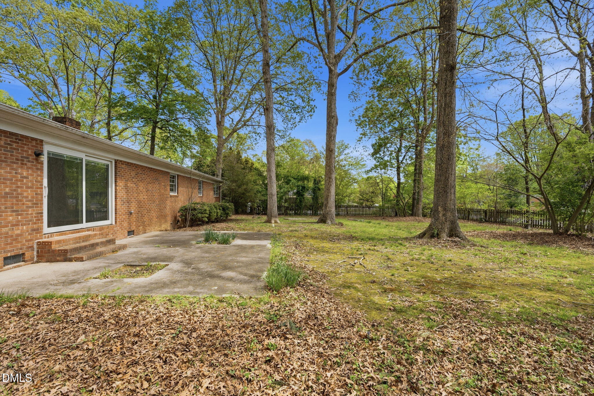 511 Hunter Street Durham, NC 27712 - Photo 26 of 30 a view of a house with backyard and trees