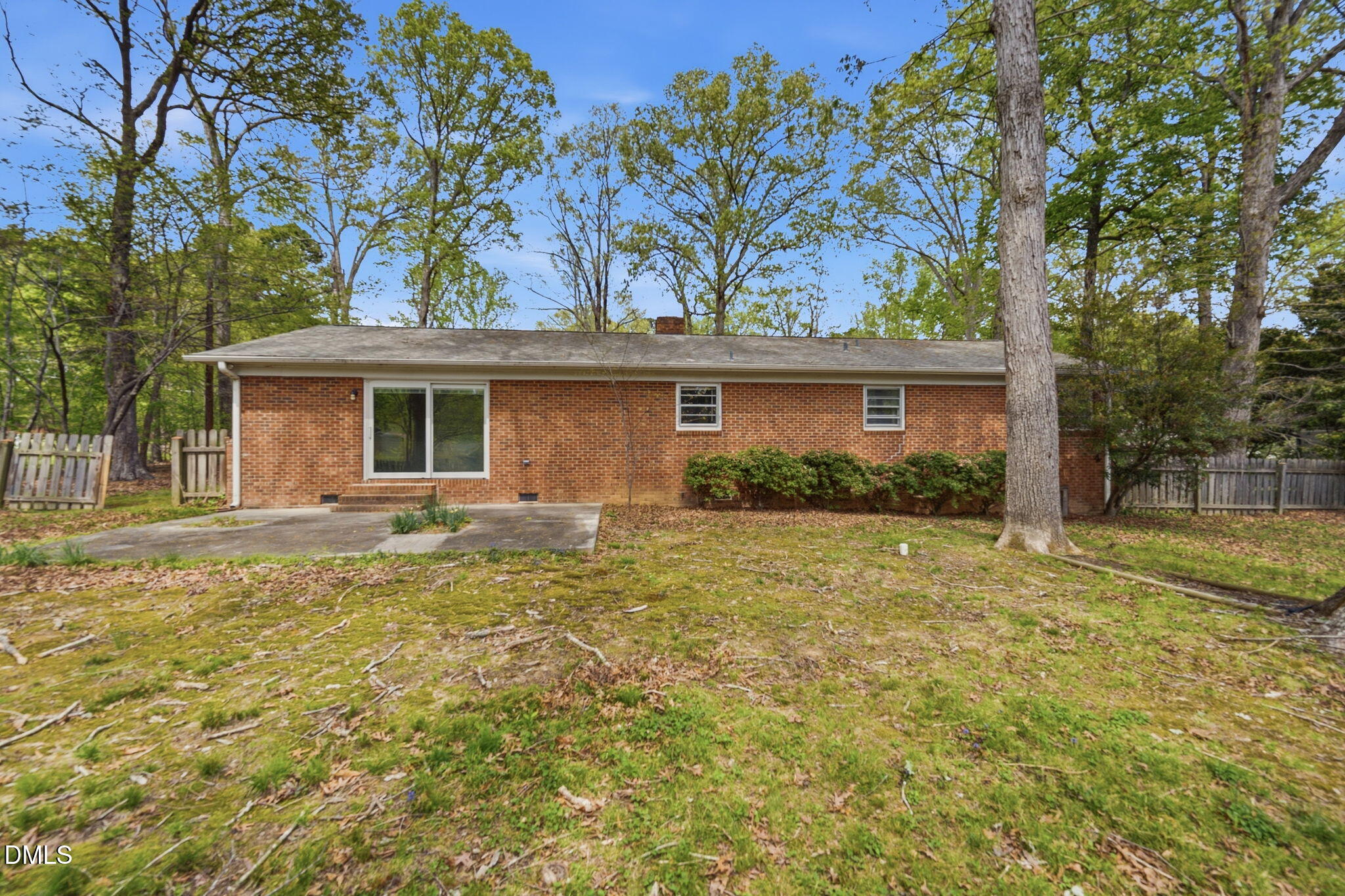 511 Hunter Street Durham, NC 27712 - Photo 27 of 30 a front view of house with yard and trees in the background
