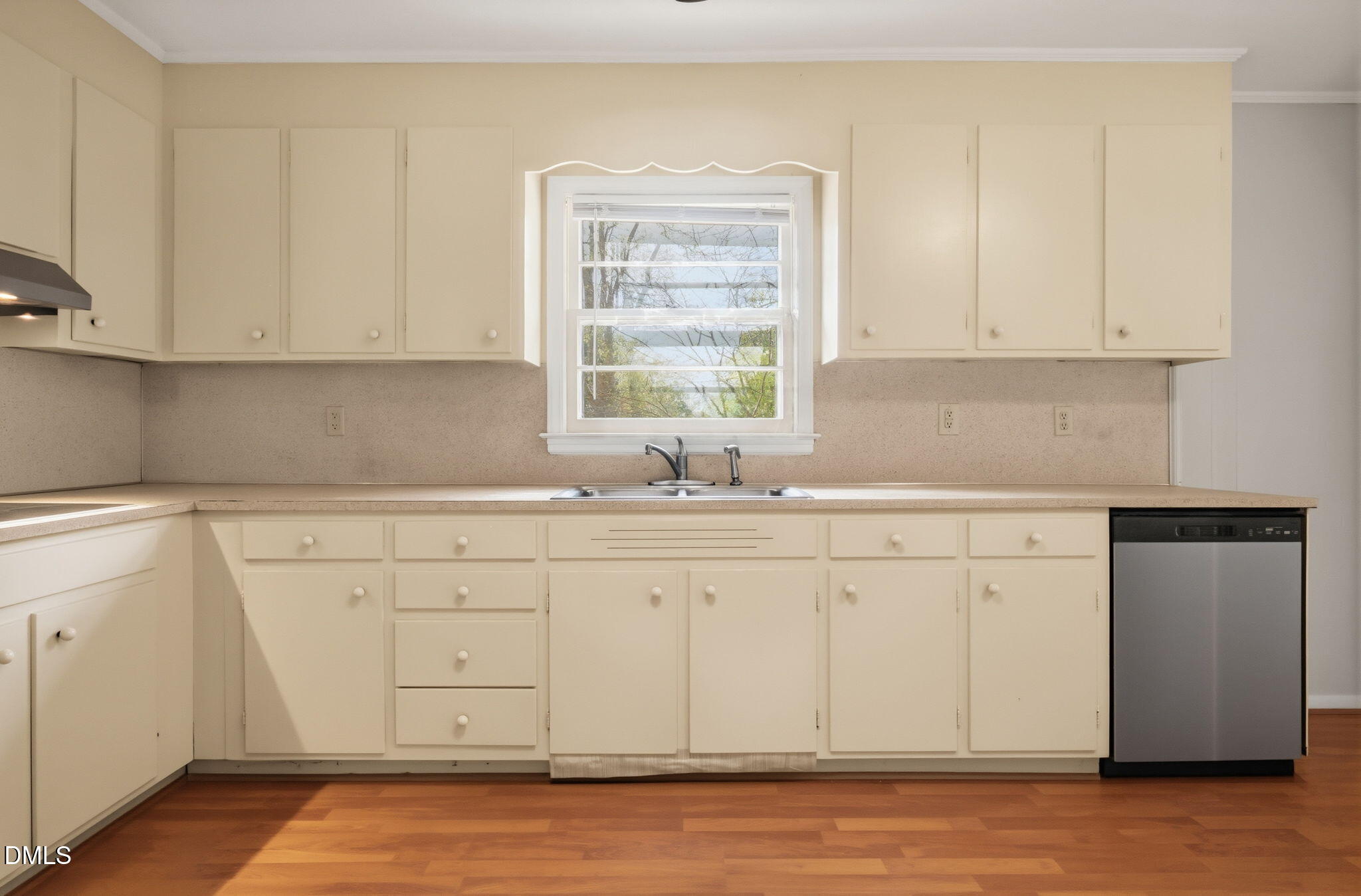 511 Hunter Street Durham, NC 27712 - Photo 6 of 30 a kitchen with granite countertop white cabinets and sink