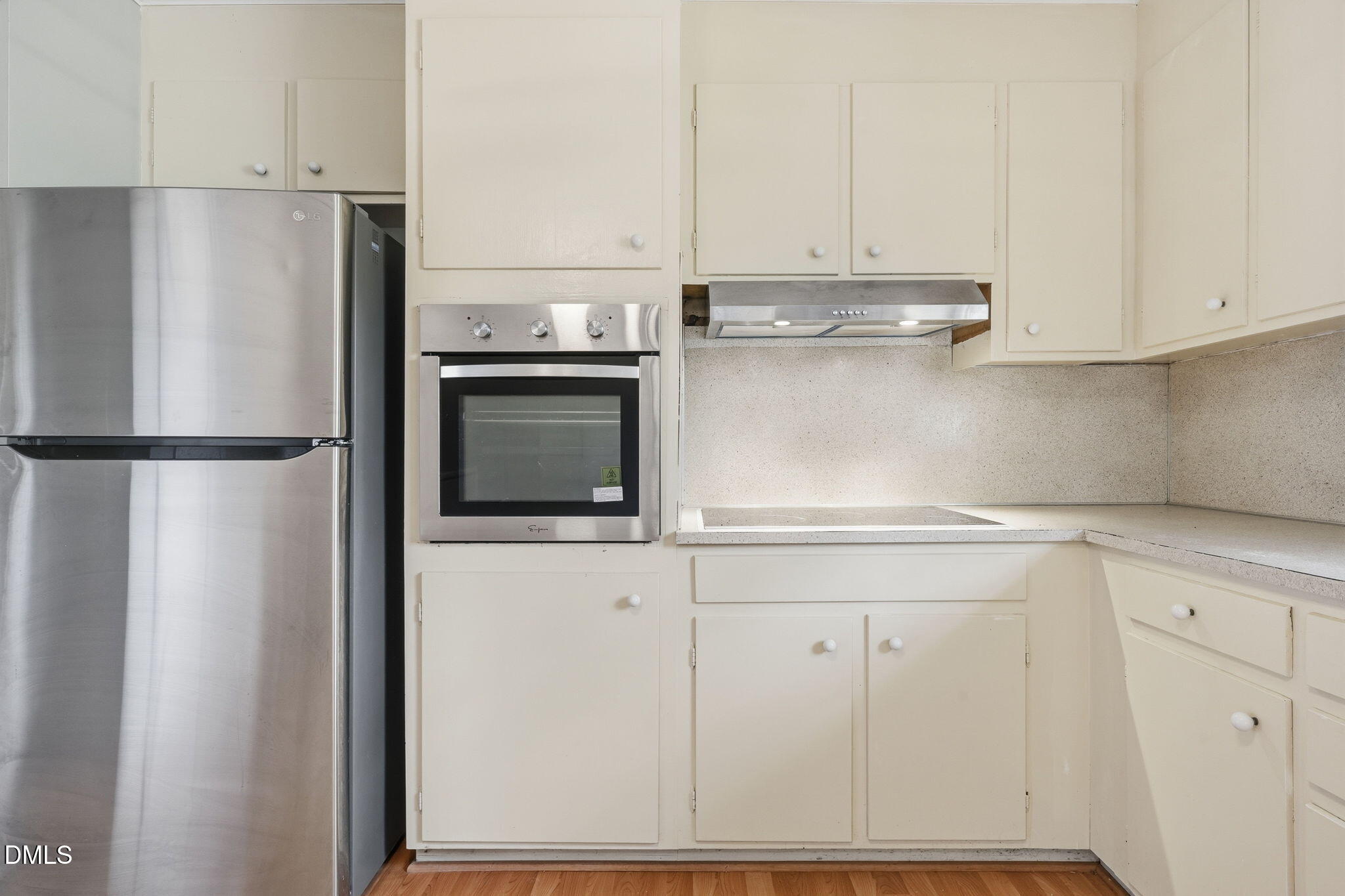 511 Hunter Street Durham, NC 27712 - Photo 8 of 30 a kitchen with cabinets and stainless steel appliances
