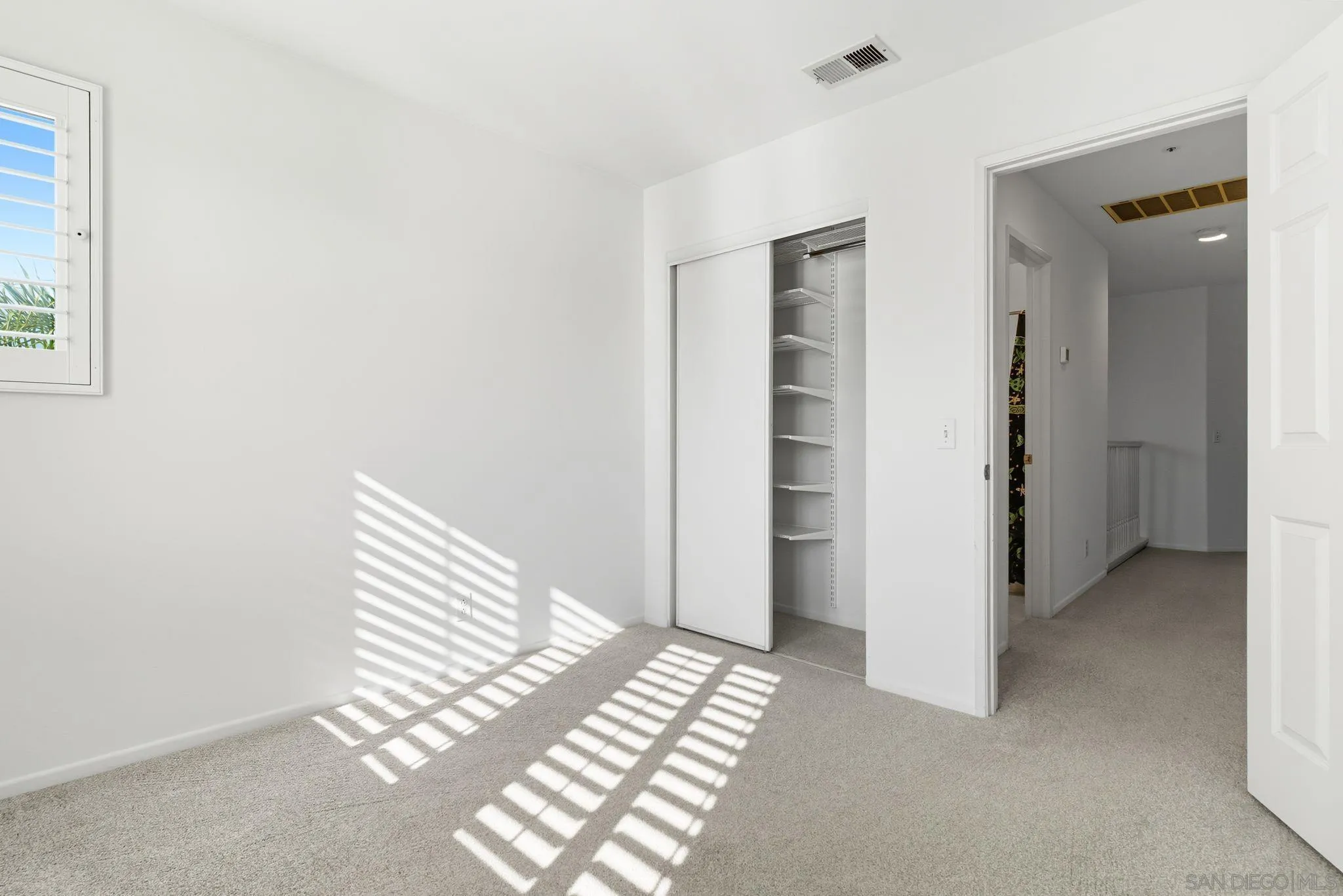 1802 Key Largo Road Vista, CA 92081 - Photo 20 of 24 a view of a room with stairs and a window
