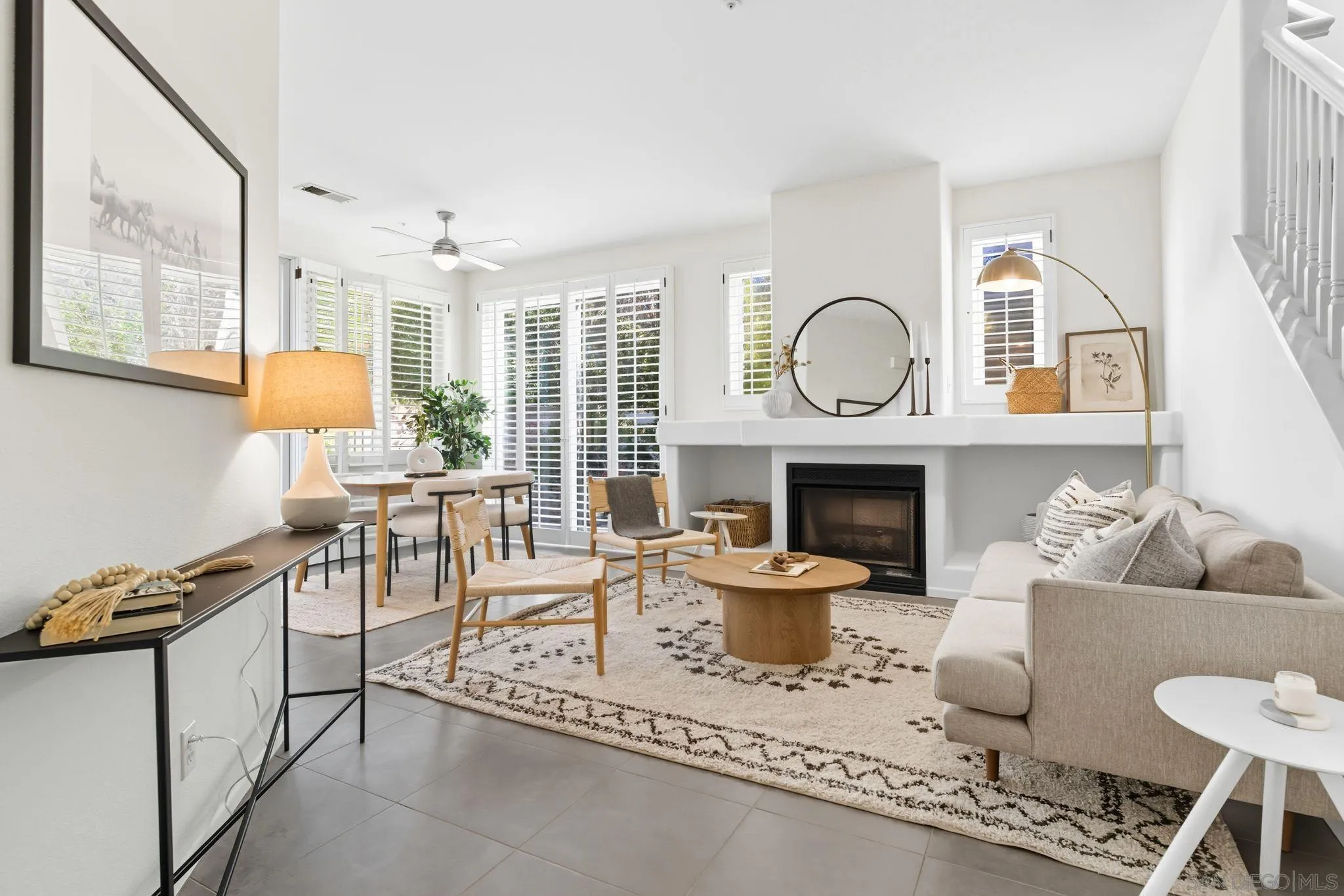 1802 Key Largo Road Vista, CA 92081 - Photo 2 of 24 a living room with furniture a fireplace and a large window