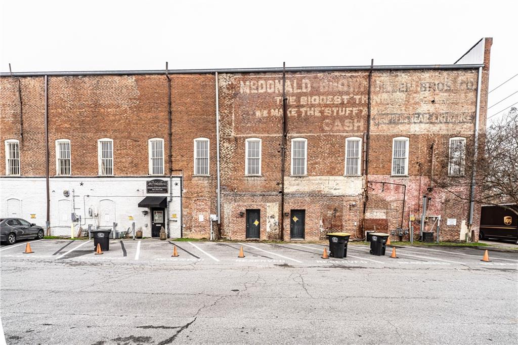 8 East 3rd Avenue Rome, GA 30161 - Photo 4 of 19 a city street lined with buildings and a street