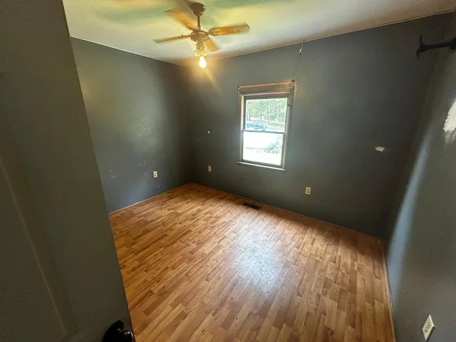 a view of an empty room and window