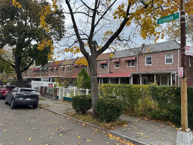 a view of a car parked in front of a building