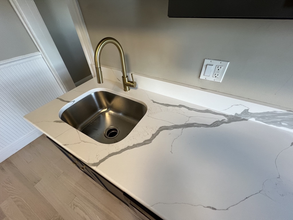 1 Orient Avenue, Unit 3C Boston, MA 02128 - Photo 4 of 25 a close view of sink and tap
