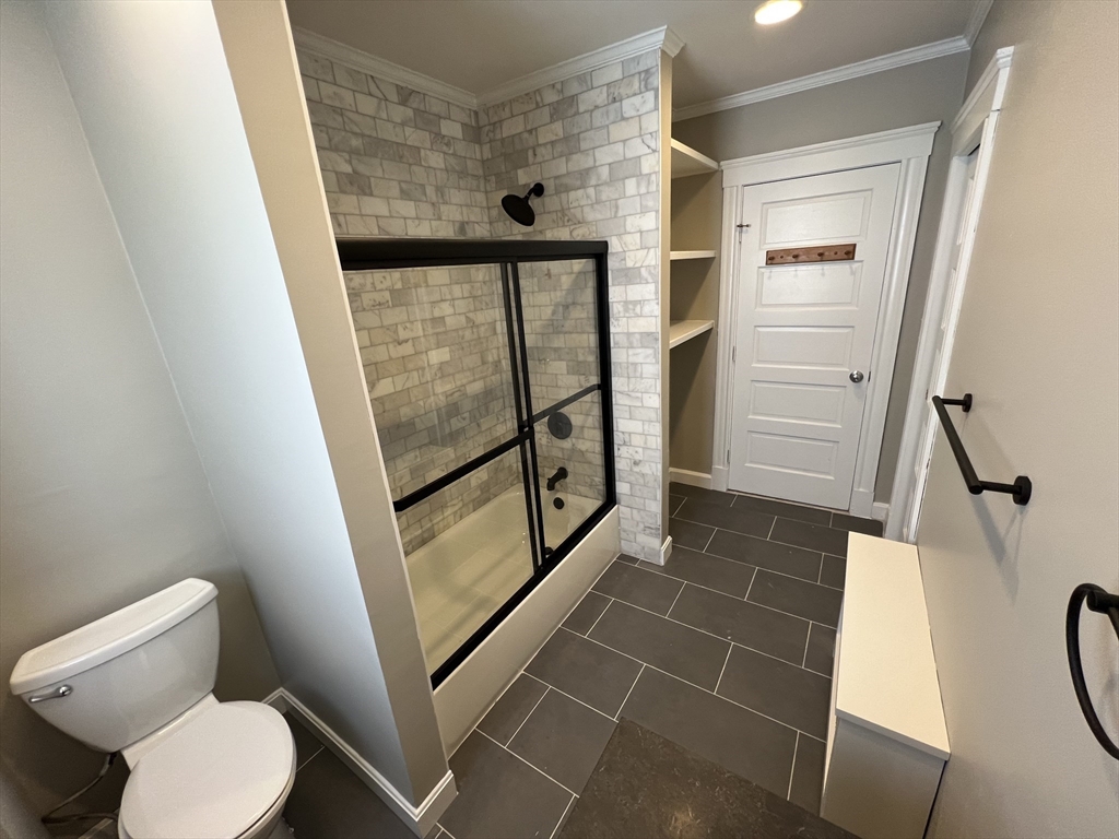 1 Orient Avenue, Unit 3C Boston, MA 02128 - Photo 8 of 25 a bathroom with a toilet and a shower