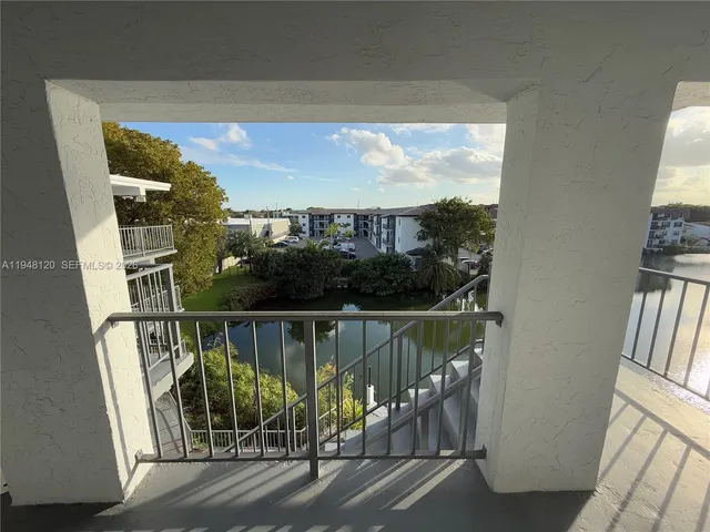 a view of balcony with furniture