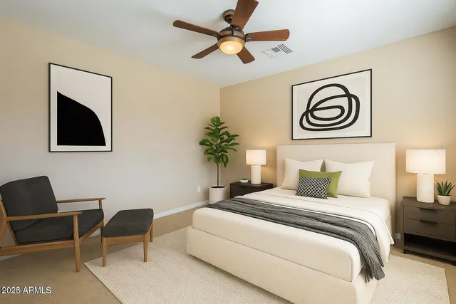 a bedroom with a bed and a chair