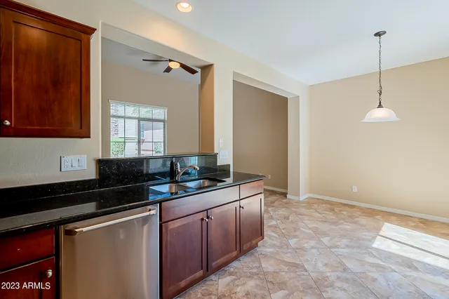 a kitchen with a sink and a refrigerator