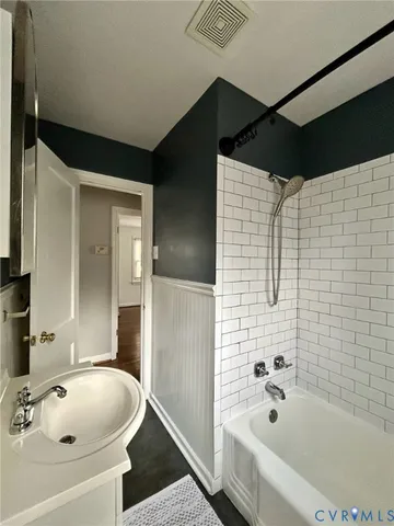 a bathroom with a sink and a bathtub