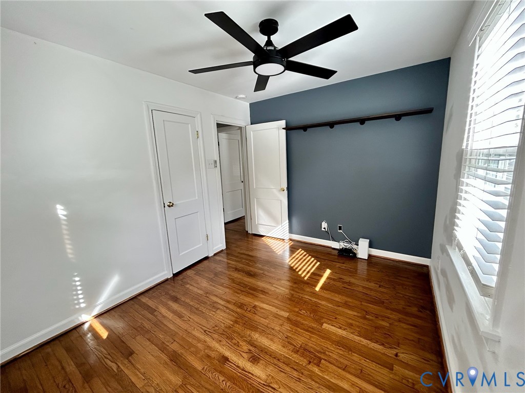 910 Forest View Drive Richmond, VA 23225 - Photo 15 of 23 wooden floor in an empty room with a window