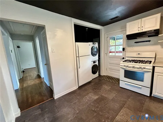 a kitchen with a stove and a microwave