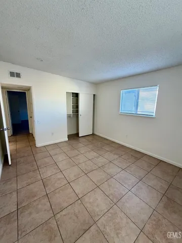 a bathroom with a toilet a sink a mirror and vanity