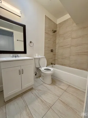 a view of an empty room and a window