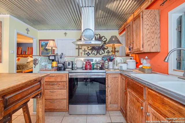 a kitchen with stainless steel appliances granite countertop a sink and cabinets