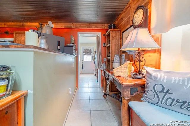 a bedroom with furniture and a wooden floor