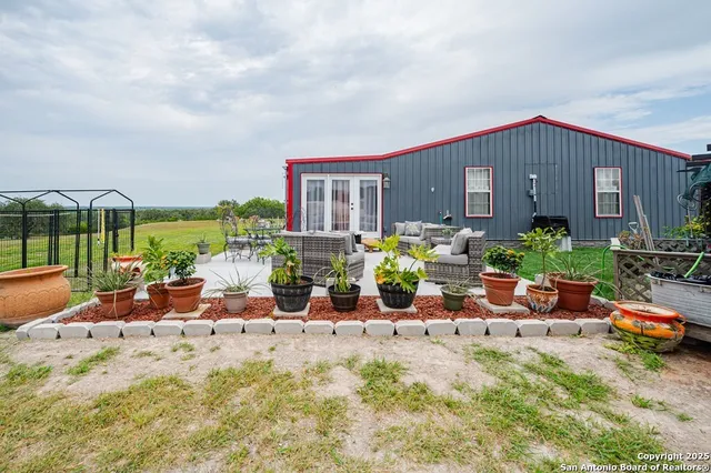 a view of a chairs and table in a patio