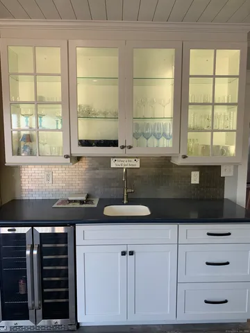 a bathroom with a sink and a window
