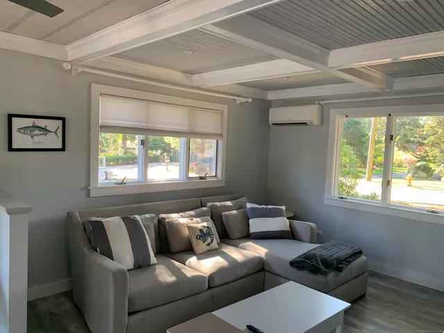 a living room with furniture and a window