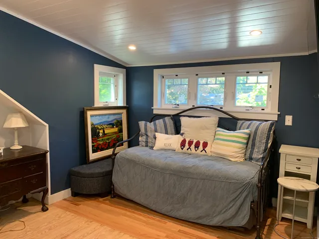 a bedroom with a bed and a tv