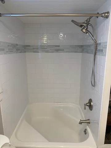 a close view of a bathtub in bathroom