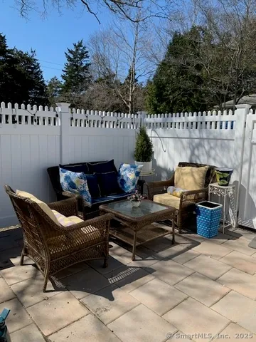 a roof deck with furniture and garden