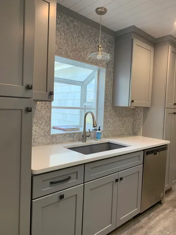 a kitchen with a sink and cabinets