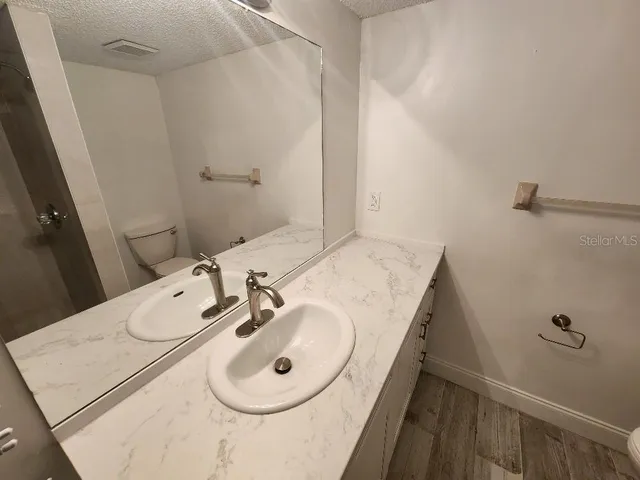 a bathroom with a sink and mirror