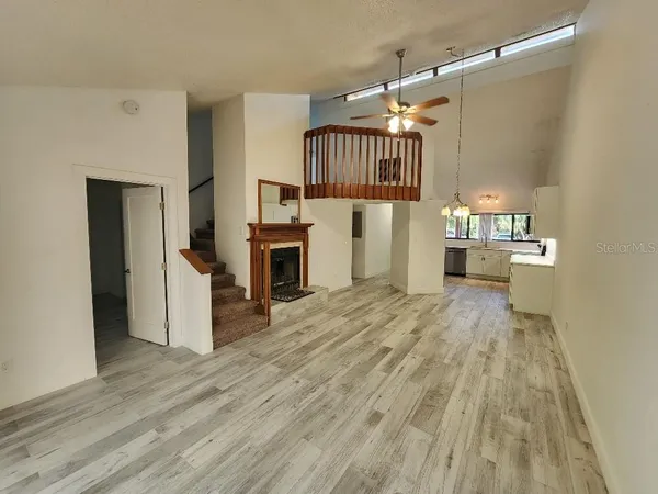 a view of a kitchen with a sink cabinet and a living room