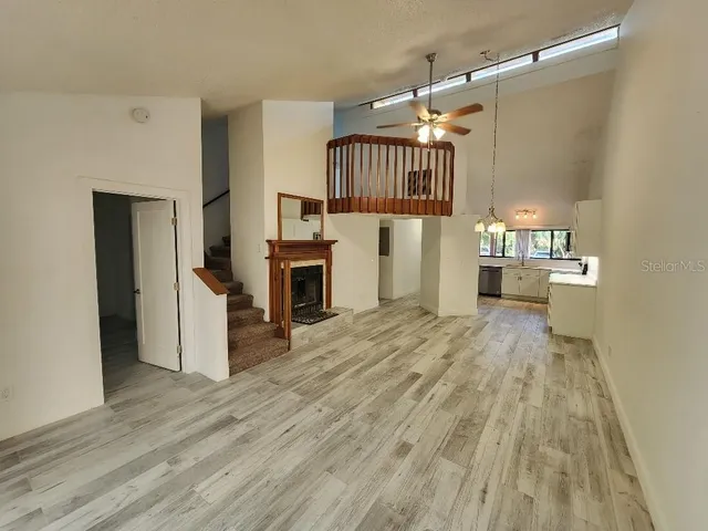a view of a kitchen with a sink cabinet and a living room