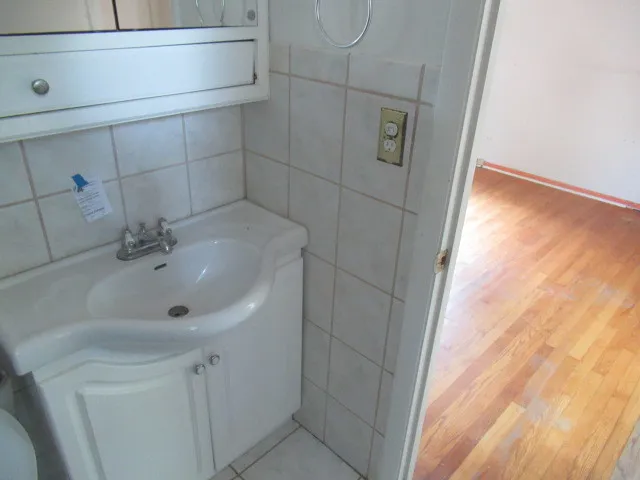 a bathroom with a sink and vanity