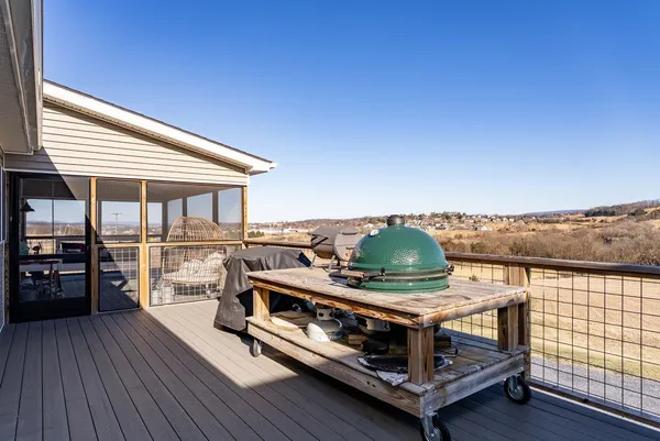 a view of hallway with stairs and wooden floor