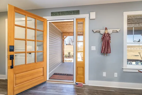 a living room with furniture a rug and a chandelier