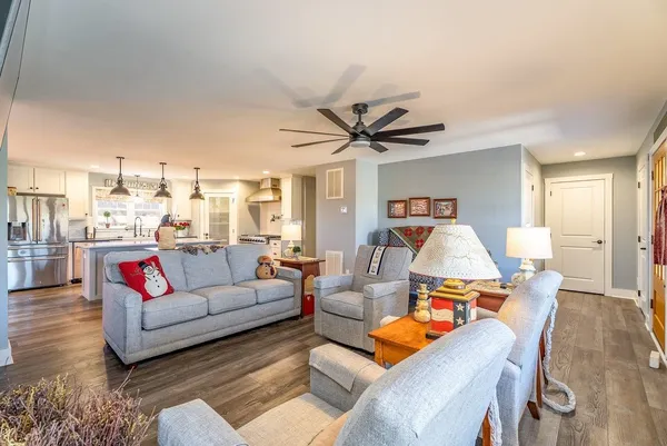 a living room with furniture and a fireplace
