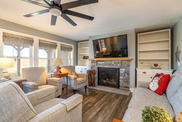 a large kitchen with stainless steel appliances granite countertop a stove oven and a refrigerator