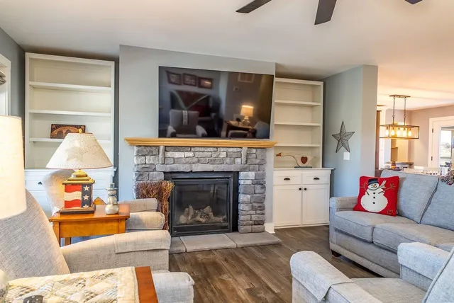 a kitchen with stainless steel appliances granite countertop a sink stove and cabinets
