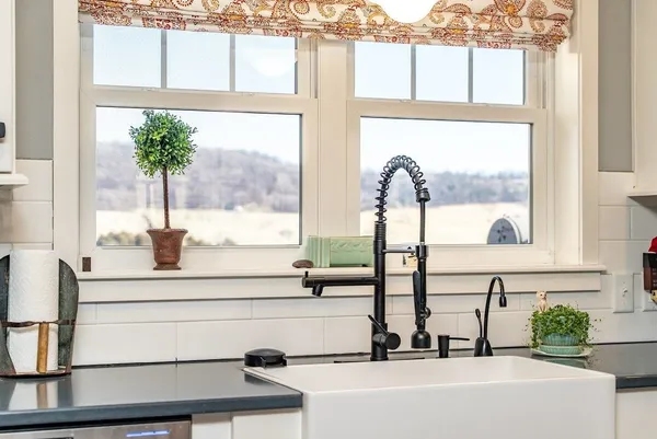 a view of a dining room with furniture wooden floor and a chandelier