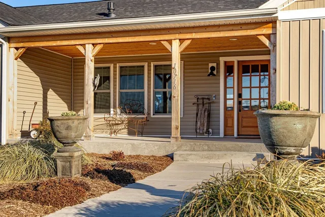 a front view of a house with swimming pool