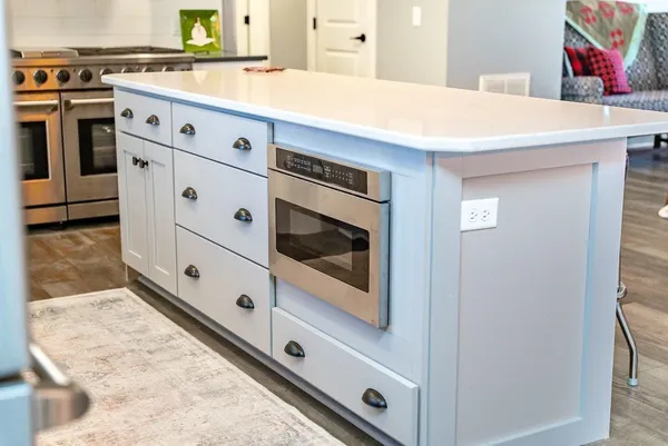 a white bath tub sitting next to a window