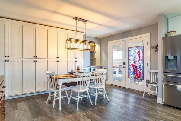 a bathroom with a granite countertop sink toilet a mirror and shower