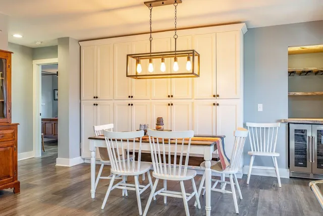 a very nice looking room with a large window and wooden floor