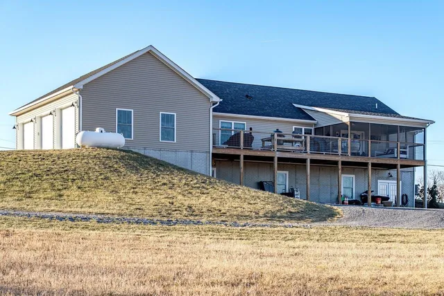 a view of a balcony dining table chairs and wooden floor