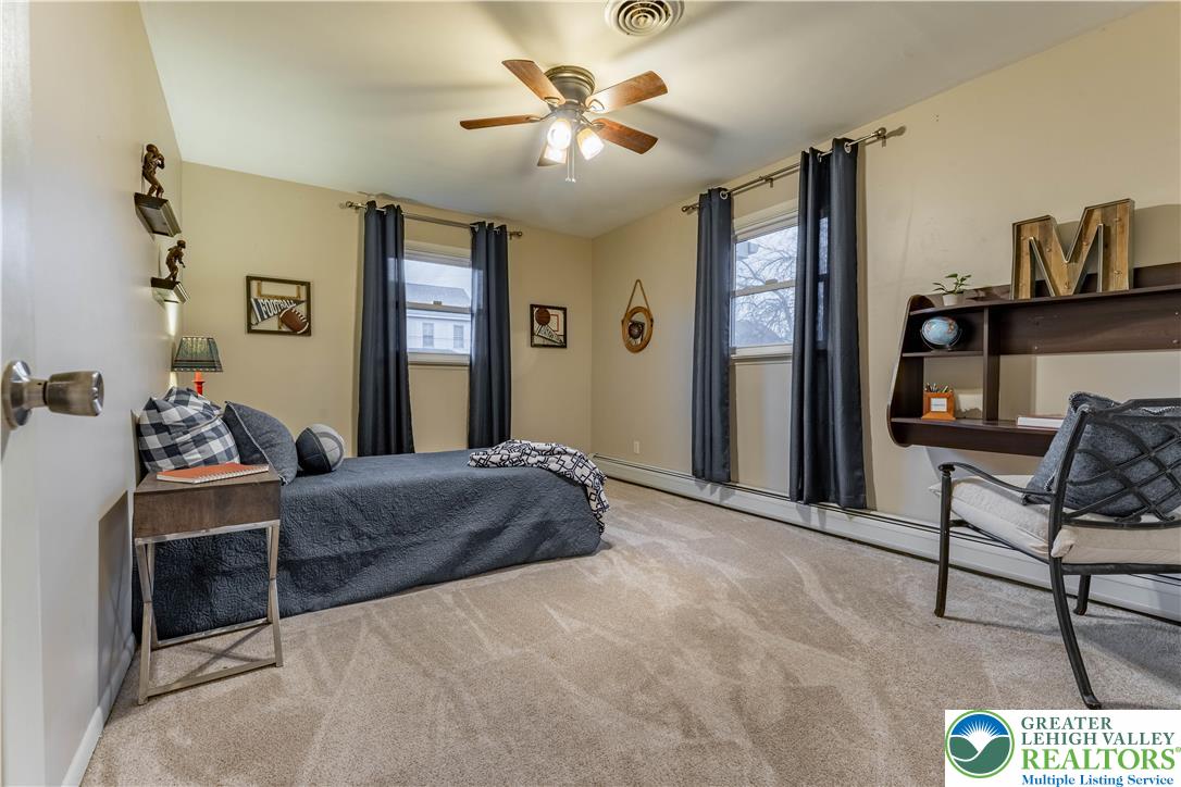 345 South Whitfield Street Nazareth, PA 18064 - Photo 14 of 29 a bedroom with a bed and a chandelier