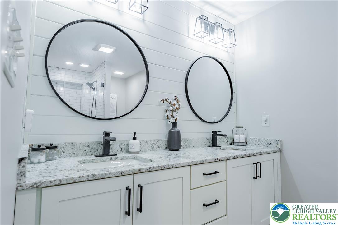 345 South Whitfield Street Nazareth, PA 18064 - Photo 15 of 29 a bathroom with a granite countertop double vanity sinks and a mirror