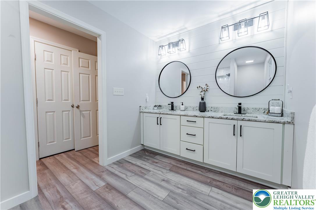 345 South Whitfield Street Nazareth, PA 18064 - Photo 16 of 29 a bathroom with a granite countertop double vanity sink and a mirror
