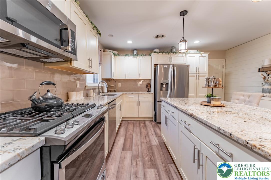 345 South Whitfield Street Nazareth, PA 18064 - Photo 7 of 29 a kitchen with stainless steel appliances granite countertop a stove and a sink