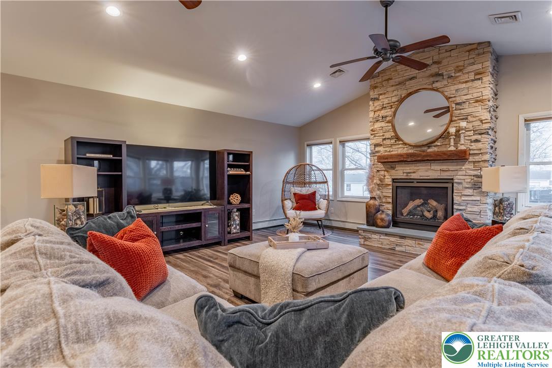 345 South Whitfield Street Nazareth, PA 18064 - Photo 10 of 29 a living room with furniture a flat screen tv and a fireplace