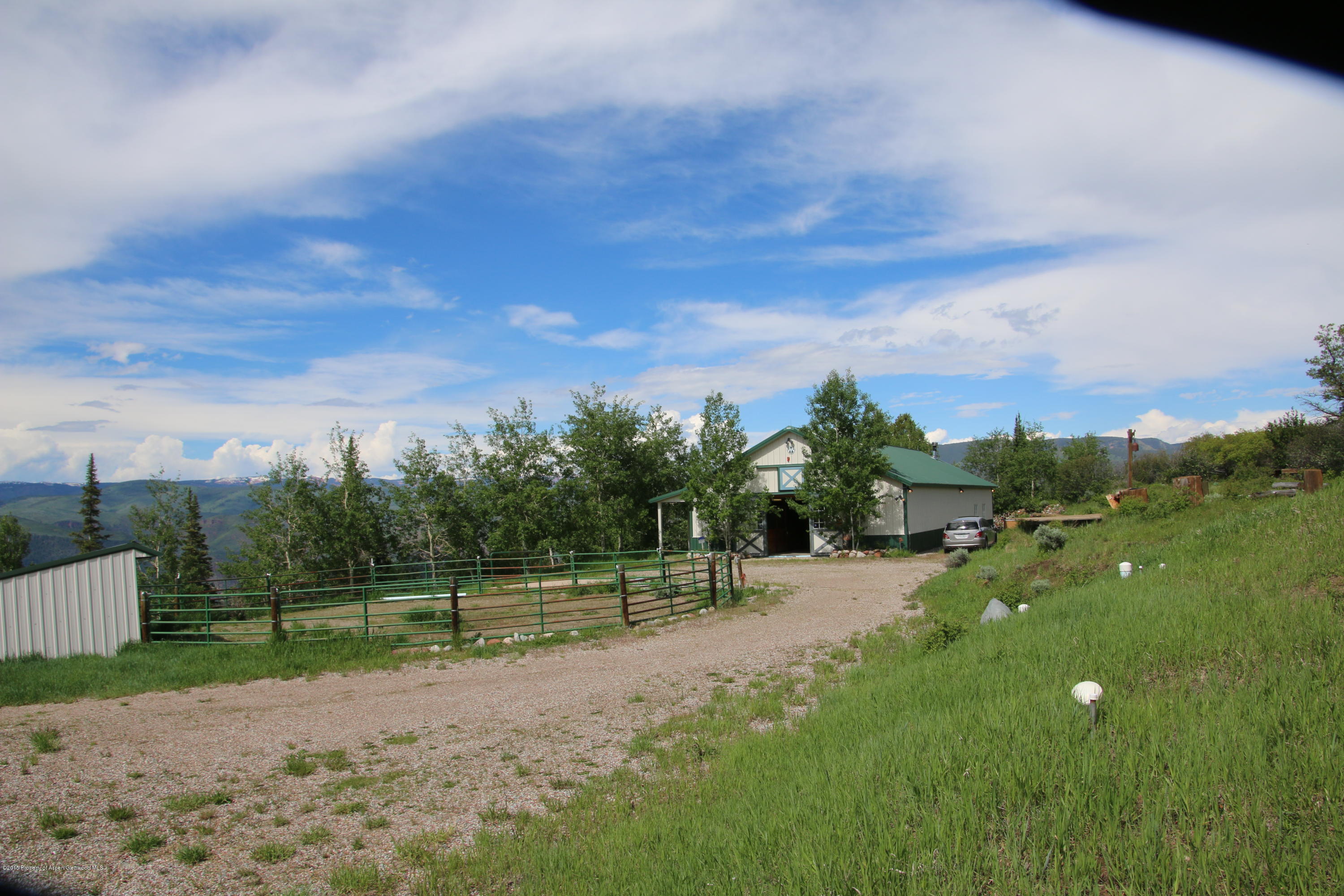 a view of a road with a yard